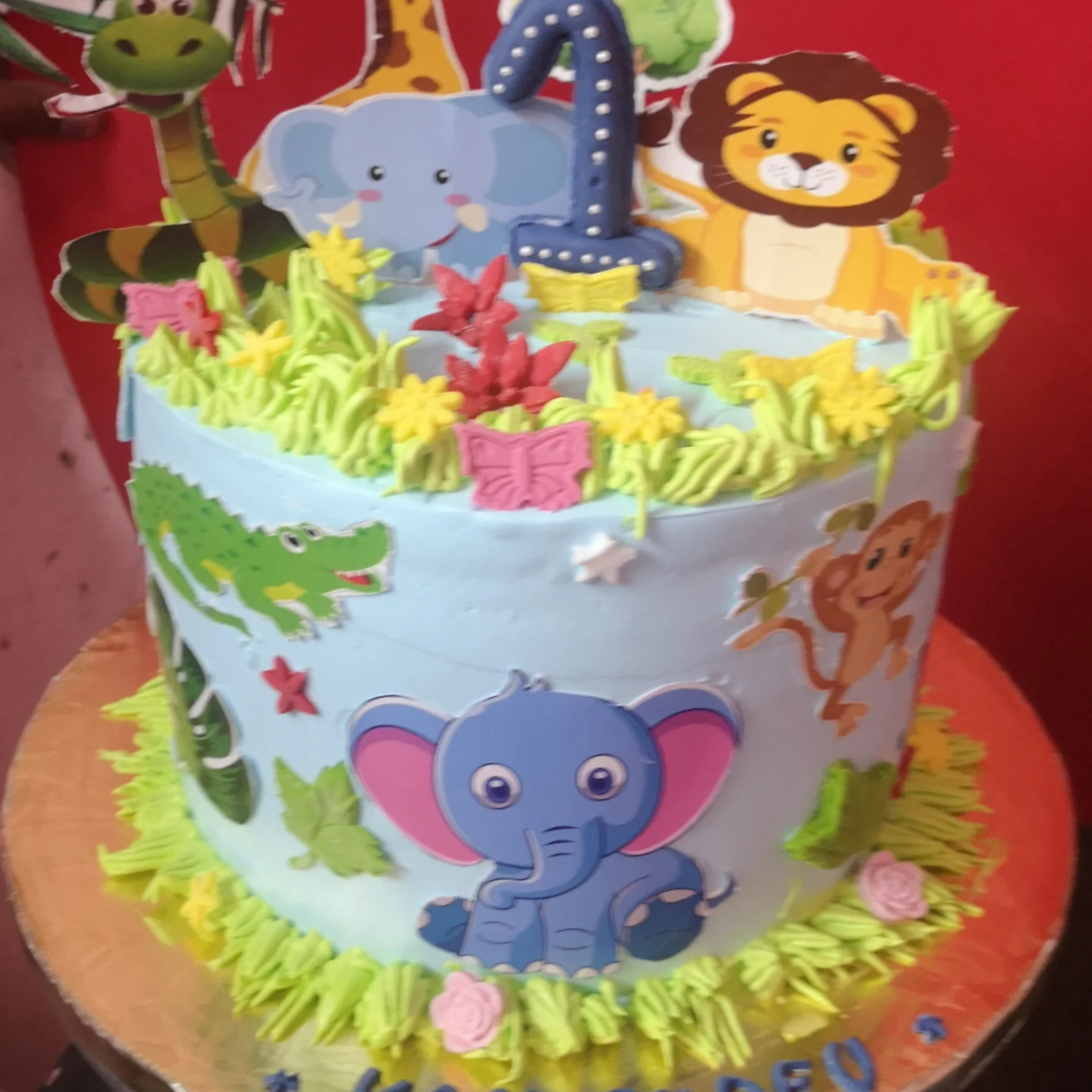 First birthday jungle-theme eggless cake with animal toppers